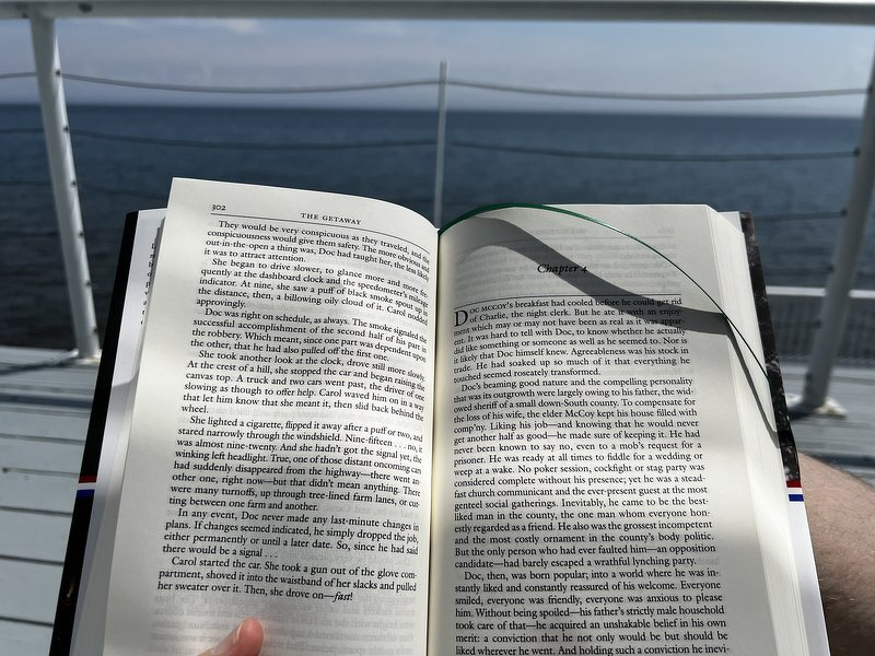 Justin reading on the deck while recovering